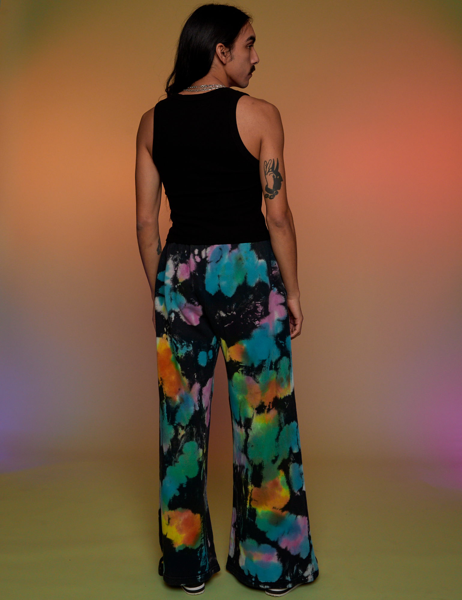 Back view of Tie Dyed Wide Leg Sweat Pants and black Tank Top on Anthony