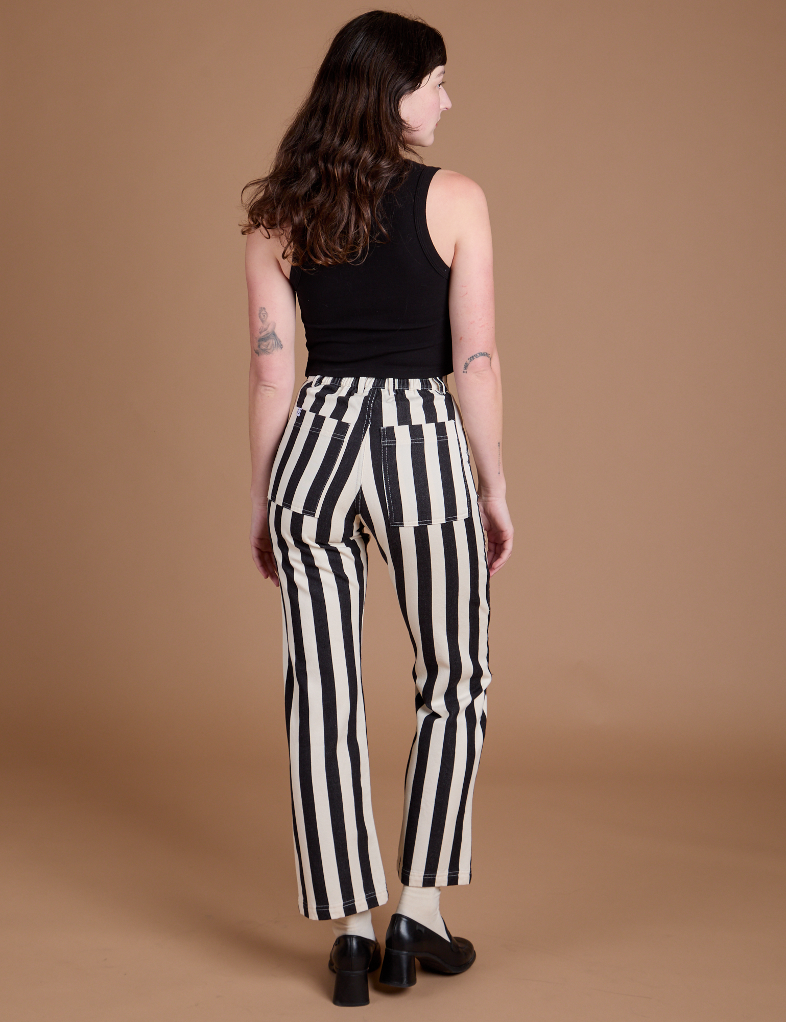 Back view of Black Stripe Work Pants in White on Alex