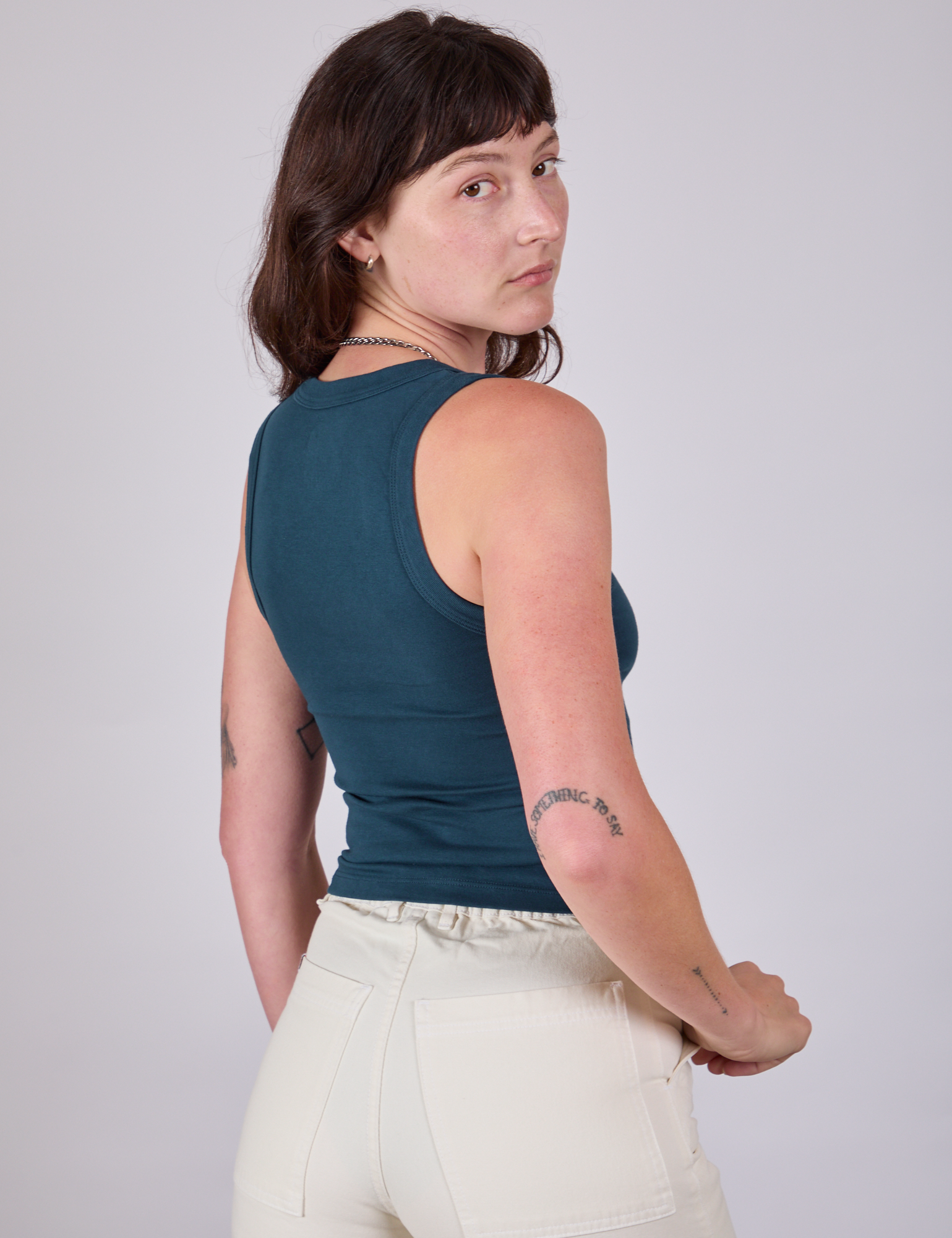 Tank Top in Lagoon angled back view on Alex