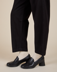 Pant leg side view close up of Heavyweight Trousers in Basic Black on Alex