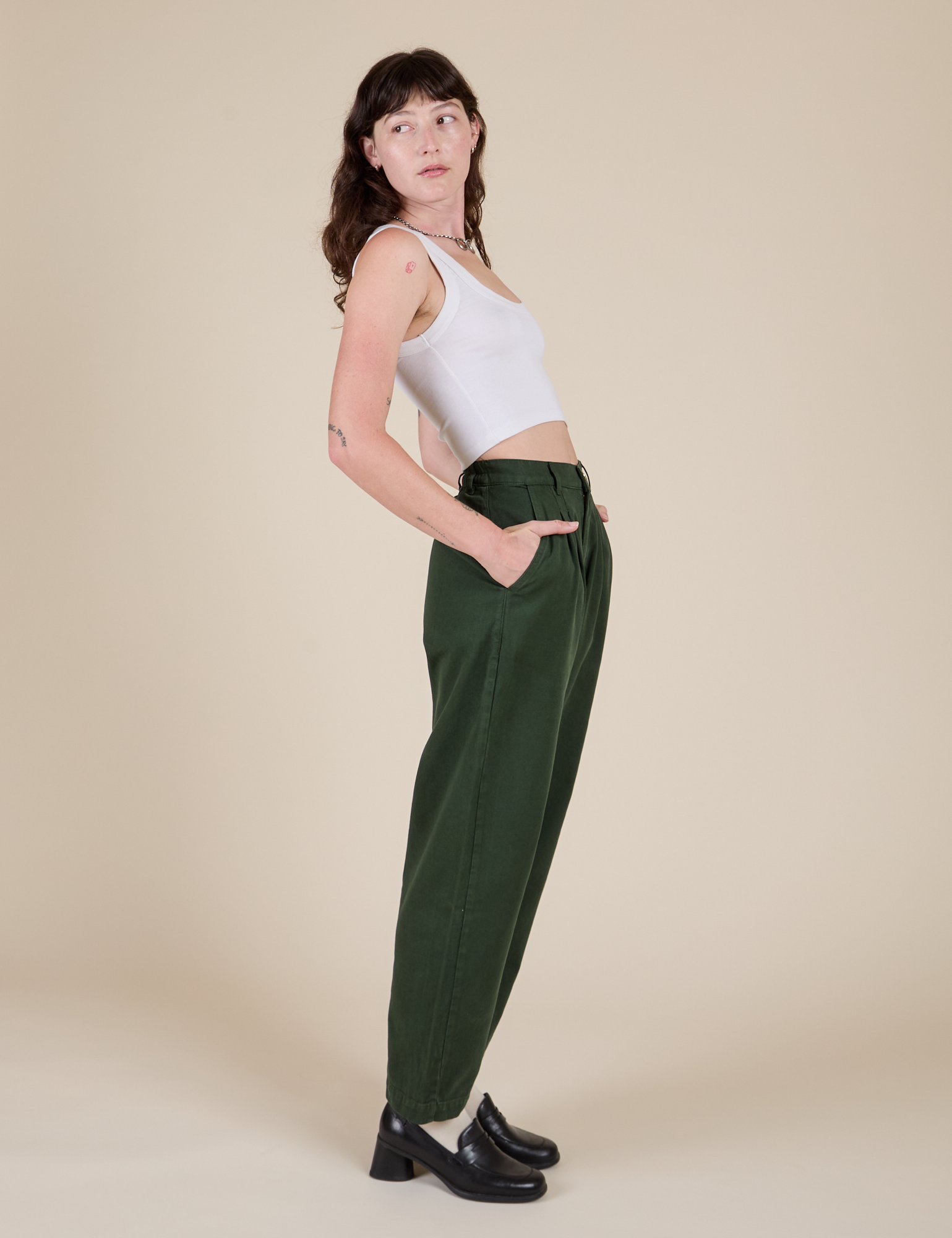 Side view of Heavyweight Trousers in Swamp Green and Cropped Tank in vintage tee white