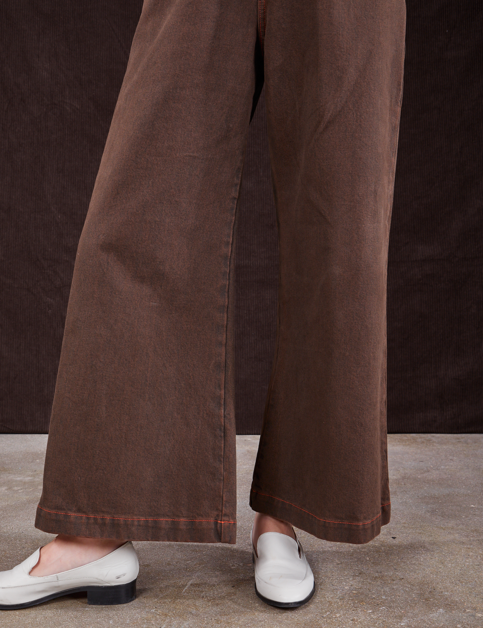 Overdyed Wide Leg Trousers in Brown pant leg close up on Alex