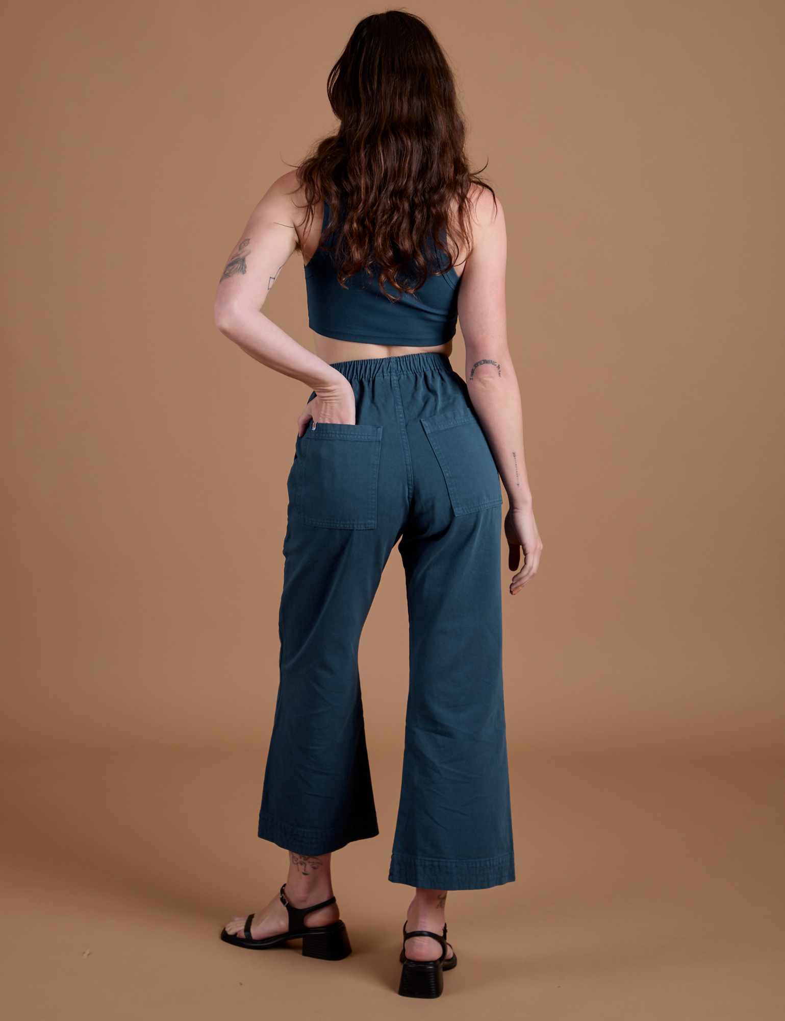 Action Pants in Lagoon back view on Alex