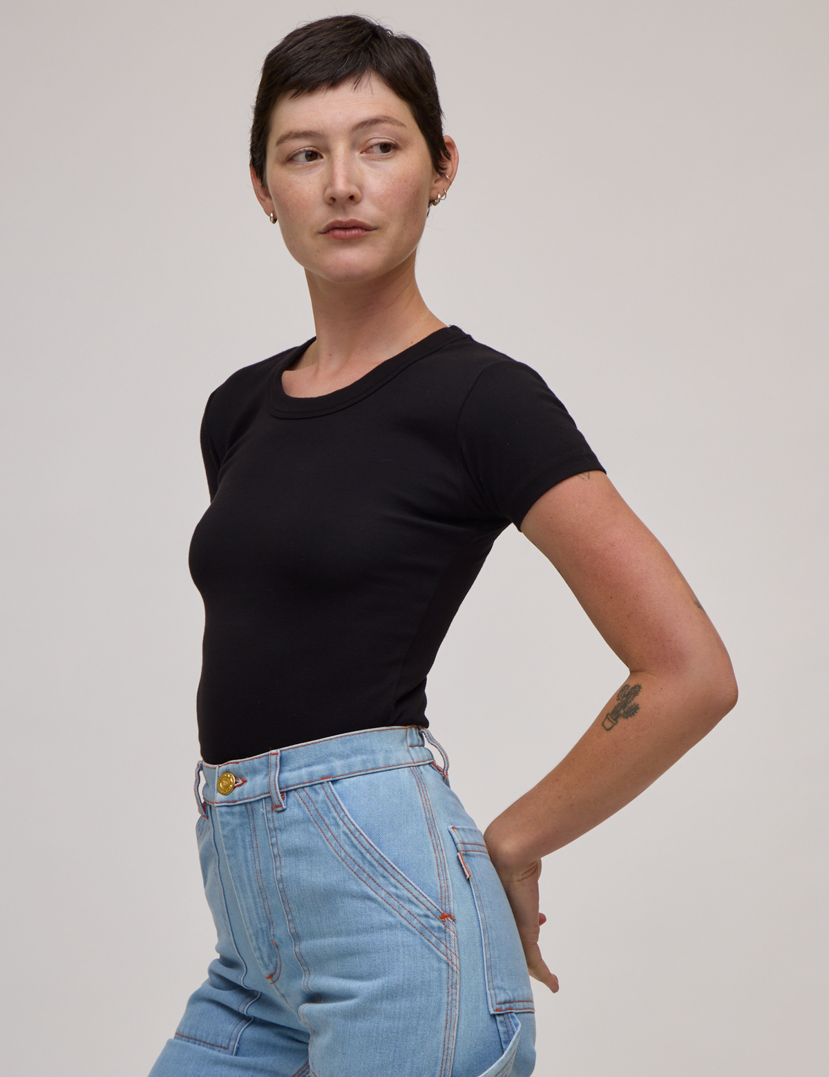 Side view of Baby Tee in Basic Black on Alex