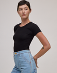 Side view of Baby Tee in Basic Black on Alex