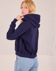 Collegiate Hoodie in Navy Blue angled back view on Margaret