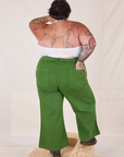 Back view of Bell Bottoms in Lawn Green and vintage off-white Halter Top on Sam