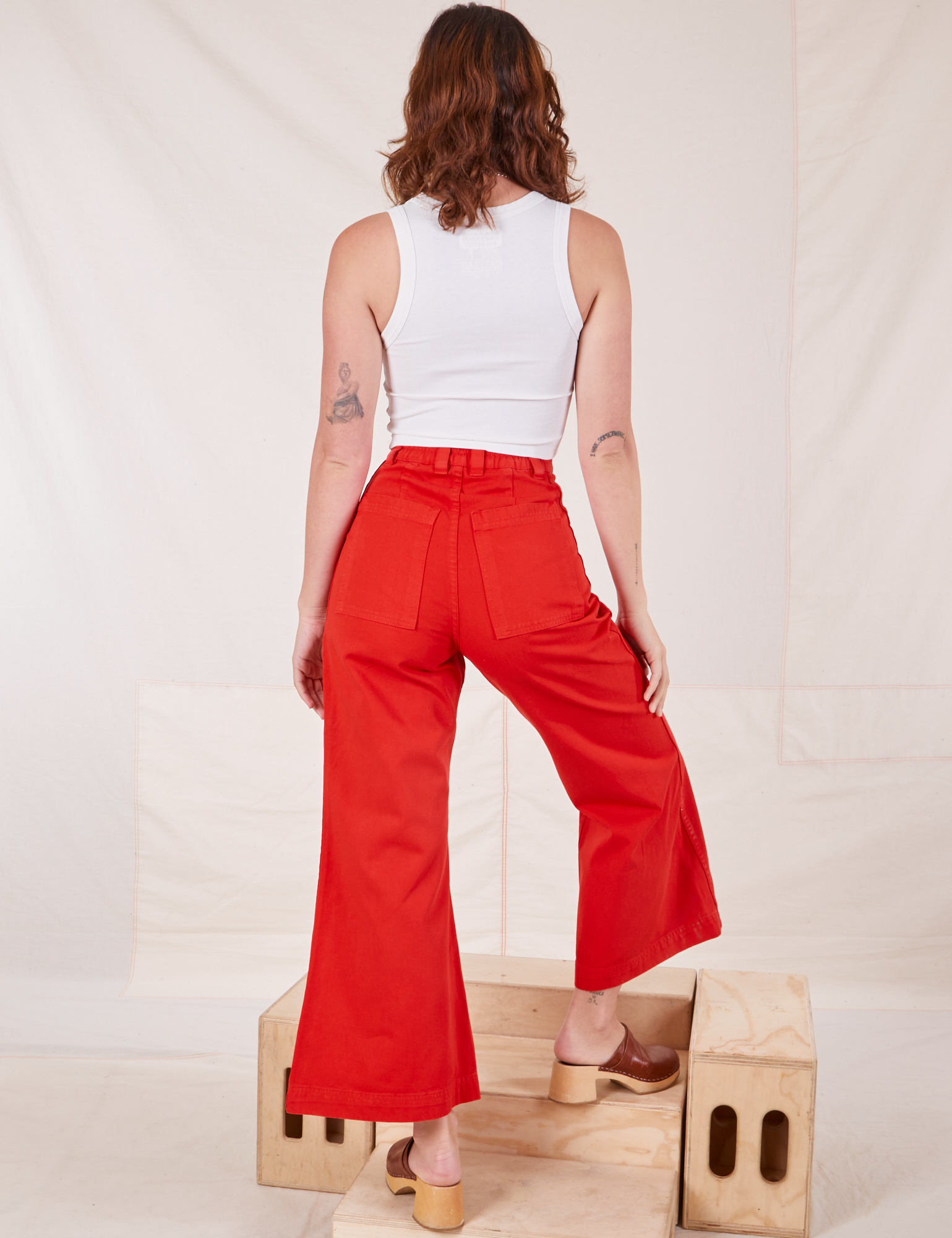 Back view of Bell Bottoms in Mustang Red and vintage off-white Cropped Tank Top