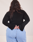 Back view of Bell Sleeve Top in Basic Black and light wash Trouser Jeans worn by Ashley