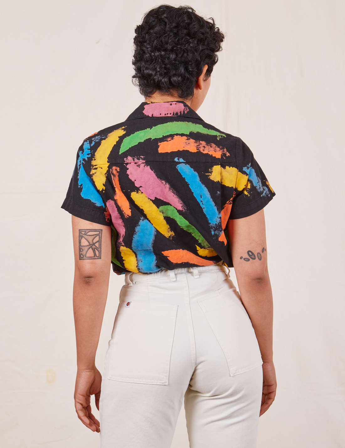 Back view of Pantry Button Up in Paint Stroke tucked into vintage off-white Western Pants worn by Mika