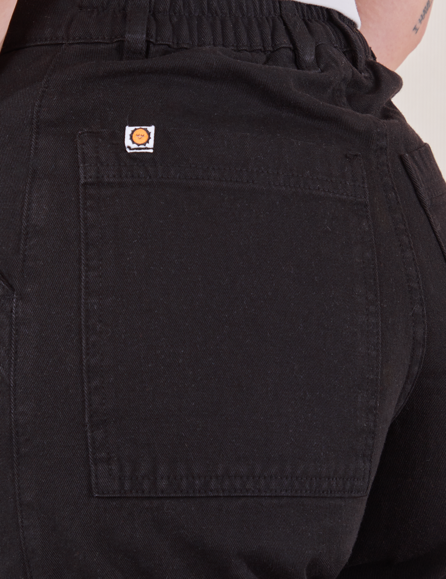 Back pocket close up of Work Pants in Black on Alex