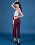 Painted Action Pants in Red Wine angled back view on Alex