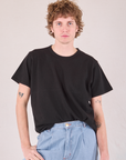 Burly Tee in Basic Black tucked into light wash Denim Wide Leg Trousers on Quinn