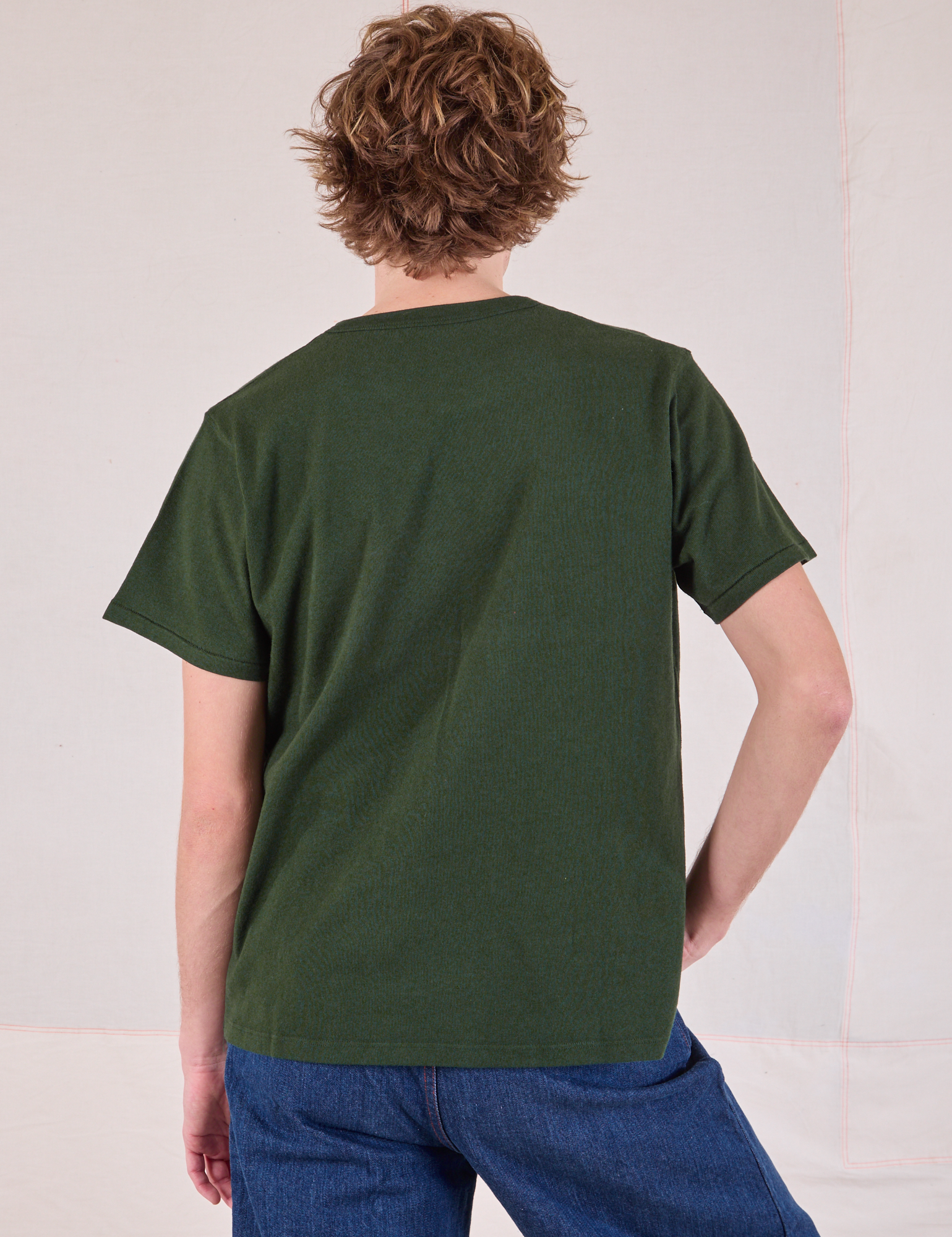 Burly Tee in Swamp Green back view on Quinn