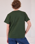 Burly Tee in Swamp Green back view on Quinn