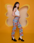 Side view of Butterfly Kaleidoscope Work Pants and Cropped Tank in Vintage Tee Off-White on Alex