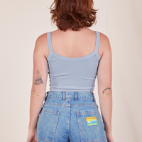 Back view of Cropped Cami in Periwinkle and light wash Frontier Jeans worn by Alex