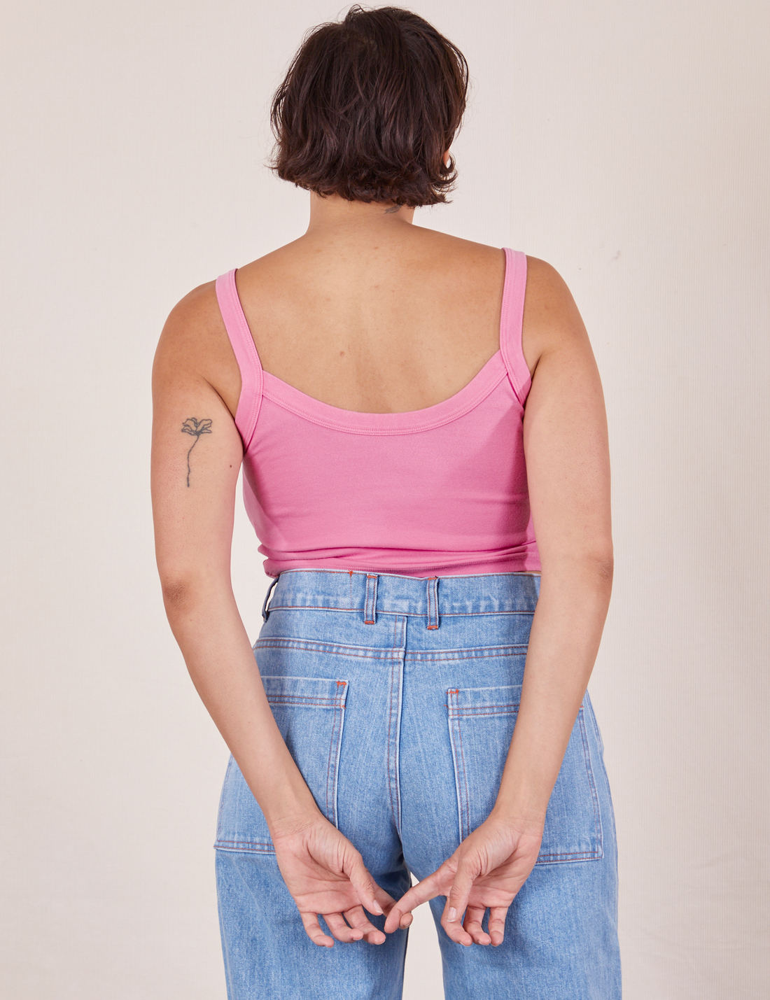 Back view of Cropped Cami in Bubblegum Pink and light wash Sailor Jeans worn by Tiara