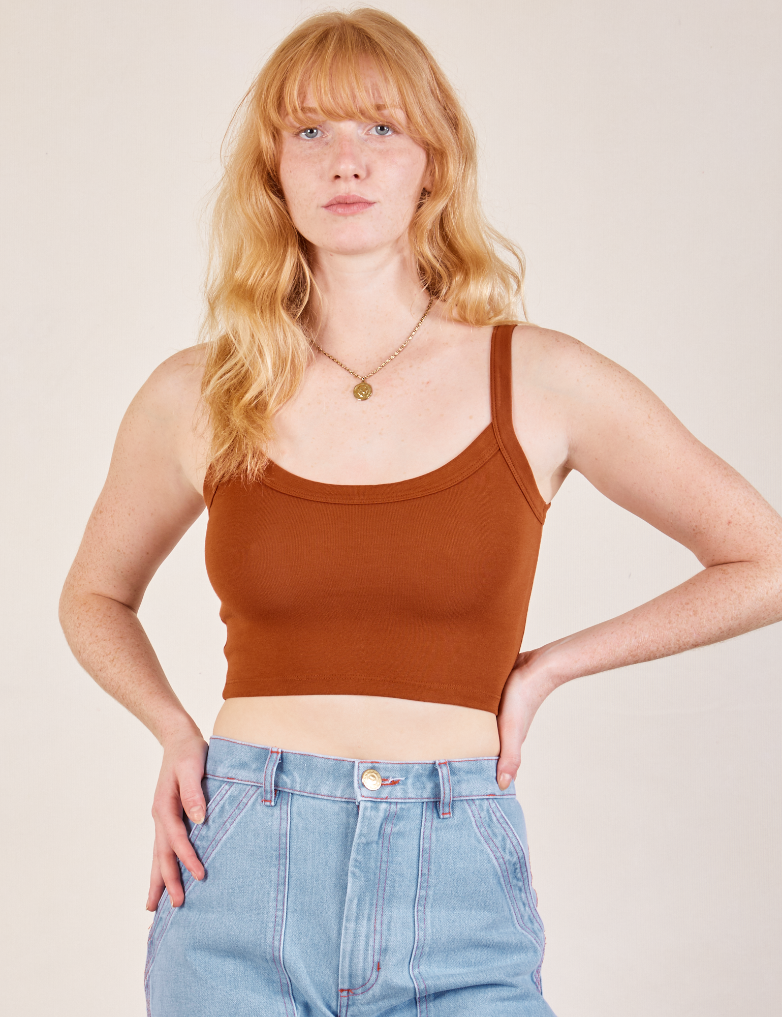 Margaret is wearing Cropped Cami in Burnt Terracotta