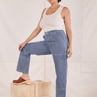 Tiara is wearing Carpenter Jeans in Railroad Stripes and vintage off-white Tank Top