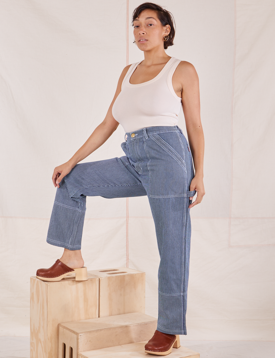 Tiara is wearing Carpenter Jeans in Railroad Stripes and vintage off-white Tank Top