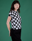 Angled front view of Checker Organic Tee in Black on Alex
