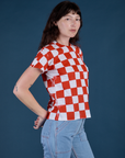 Angled front view of Checker Organic Tee in Red on Alex