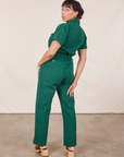 Angled back view of Short Sleeve Jumpsuit in Hunter Green worn by Tiara