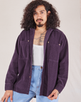 Jesse is wearing Corduroy Overshirt in Nebula Purple with a vintage off-white Cropped Tank Top underneath and light wash Trouser Jeans