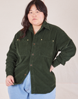 Ashley is wearing a buttoned up Corduroy Overshirt in Swamp Green