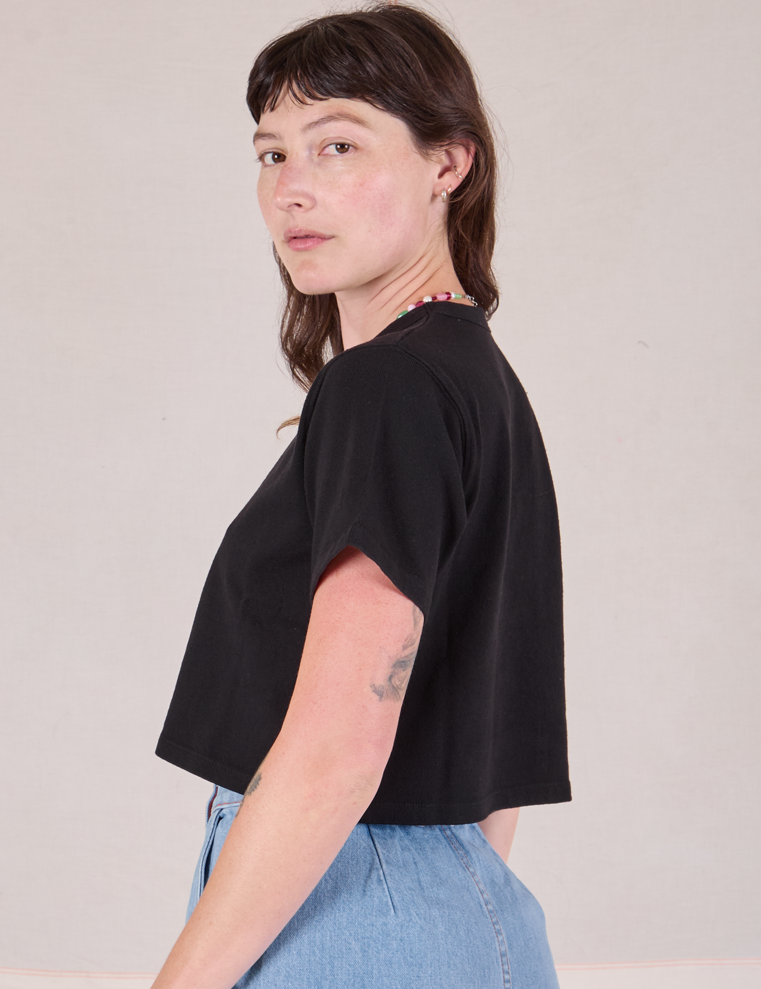 Cropped Burly Tee in Basic Black side view on Alex