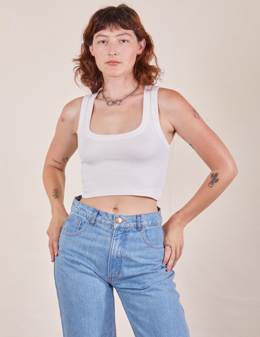 Alex is 5'8" and wearing P Cropped Tank Top in Vintage Off-White