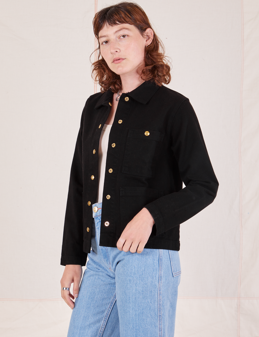 Angled view of Denim Work Jacket in Basic Black worn by Alex