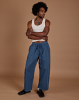 Jerrod is 6’3” and wearing M Drop Pocket Cargo Pants in French Blue paired with a Tank Top in vintage tee white
