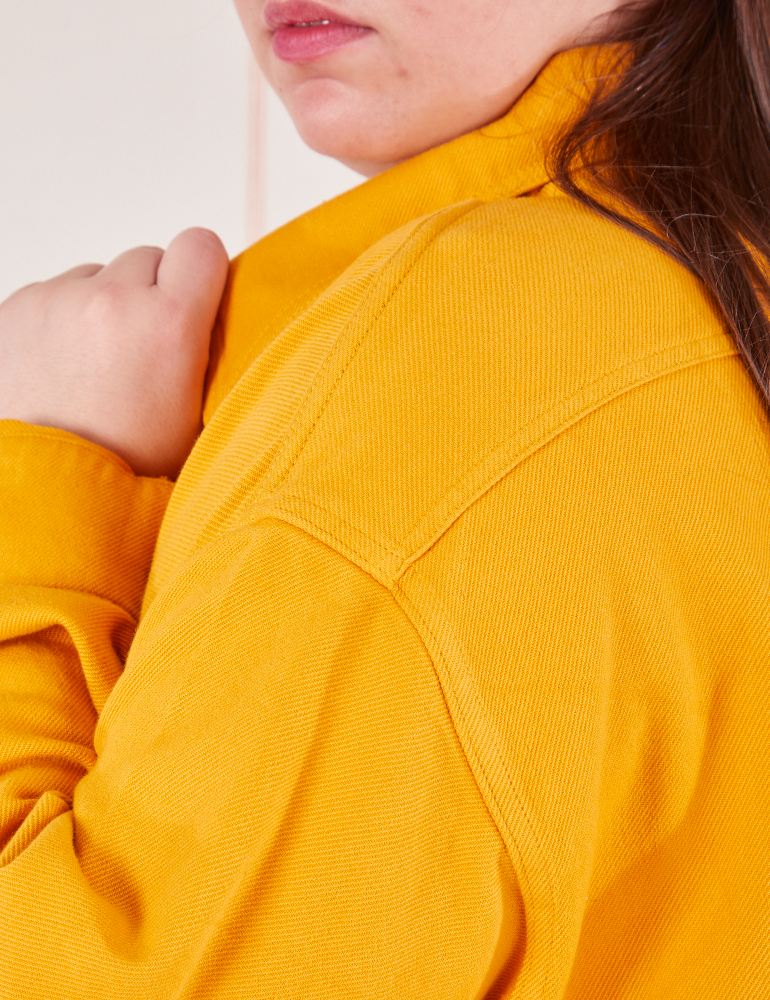 Shoulder close up of Flannel Overshirt in Mustard Yellow on Marielena
