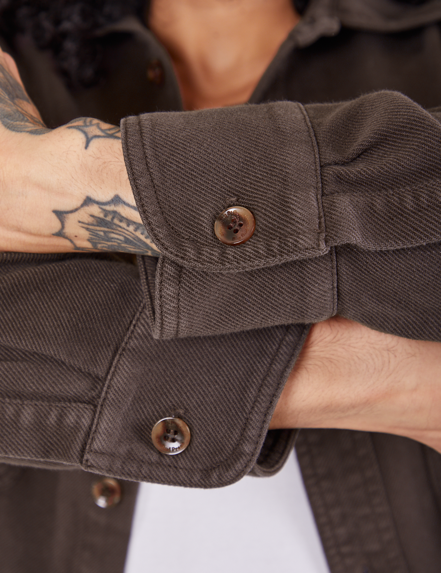 Sleeve cuffs close up of Flannel Overshirt in Espresso Brown on Jesse