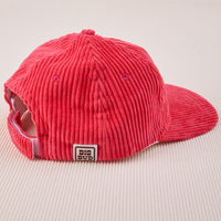 Side view of Dugout Corduroy Hat in Hot Pink. Big Bud label sewn on the side.