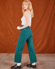 Side view of Gingham Western Pants in Green and Cropped Tank in vintage tee off-white on Margaret