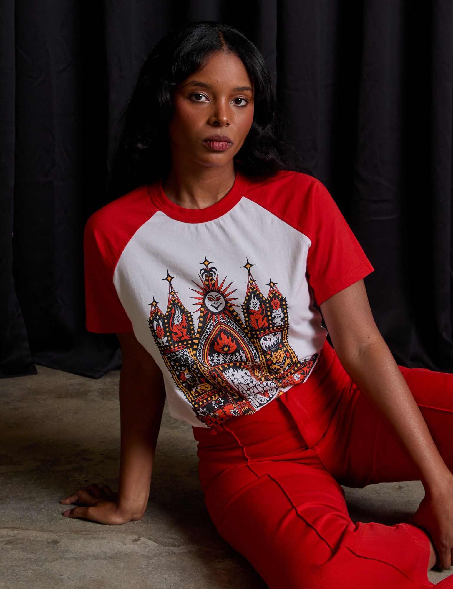 Kandia is wearing Short Sleeve Raglan Tee in Gates of Hell