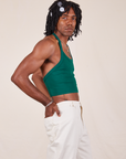 Side view of Halter Top in Hunter Green and vintage off-white Western Pants worn by Jerrod.