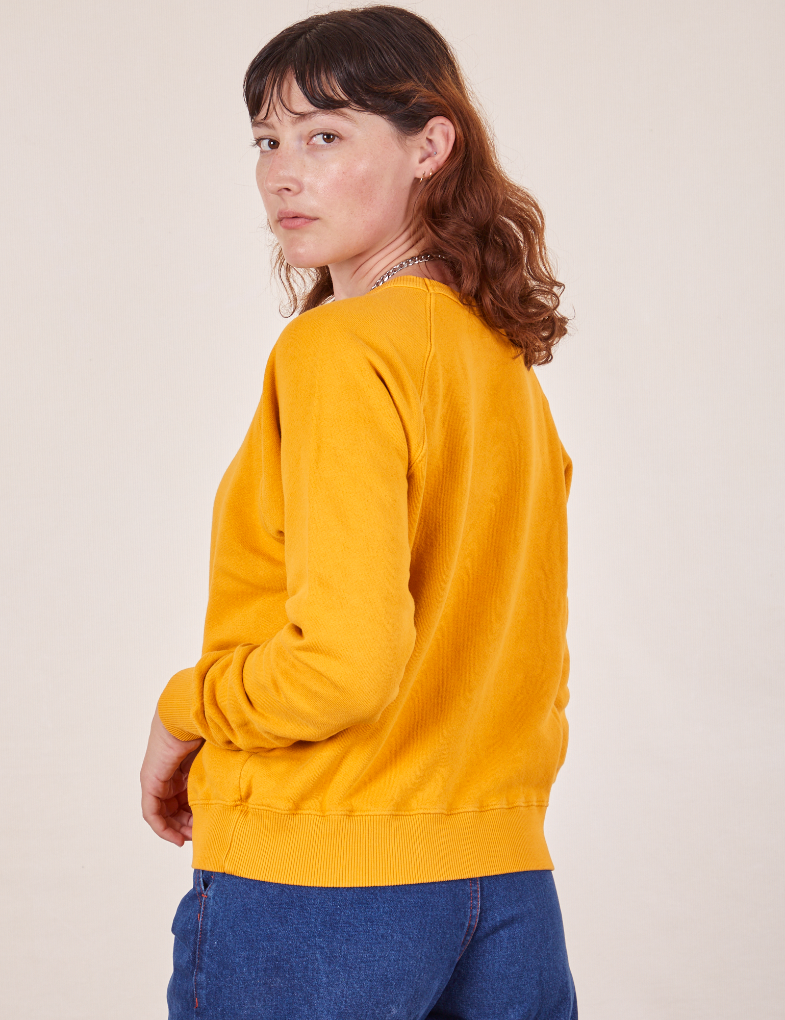 Back angled view of Heavyweight Crew in Mustard Yellow on Alex