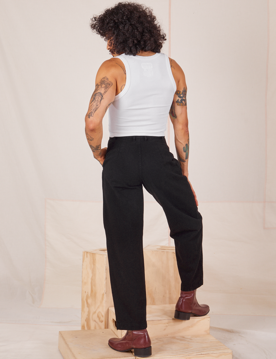 Back view of Heavyweight Trousers in Basic Black and vintage off-white Cropped Tank Top worn by Jesse