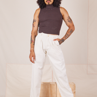 Jesse is 5'8" and wearing XXS Heavyweight Trousers in Vintage Off-White and espresso brown Sleeveless Turtleneck.
