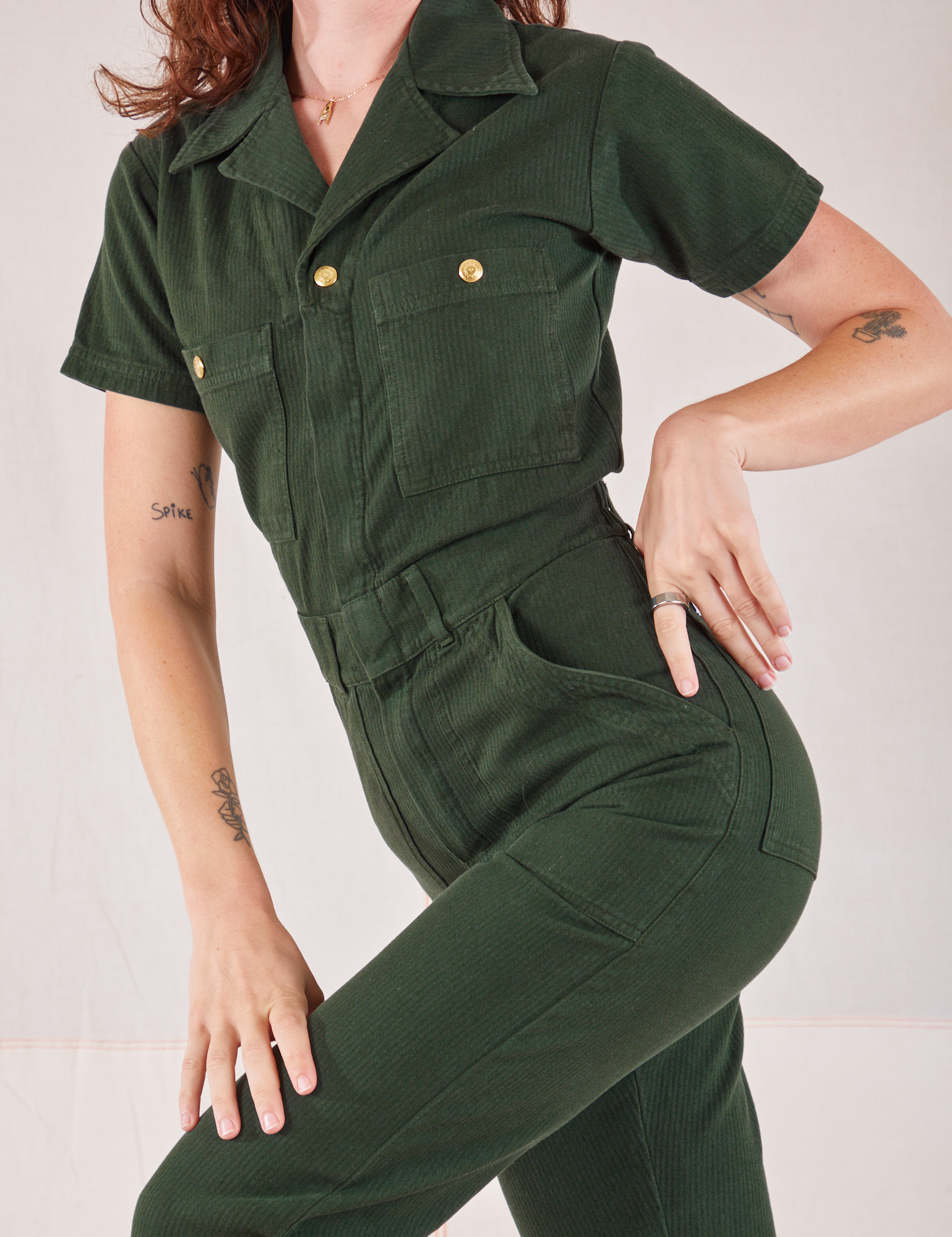 Heritage Short Sleeve Jumpsuit in Swamp Green close up on Alex