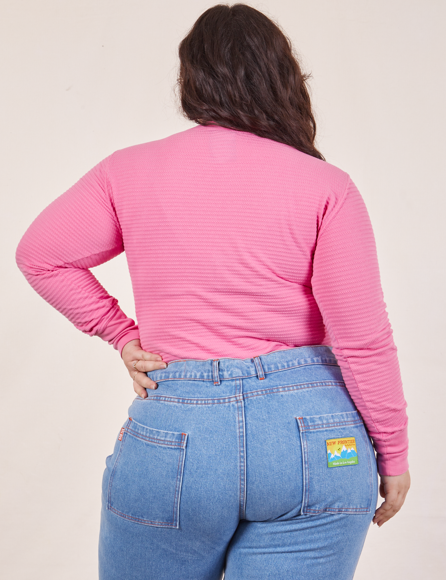 Back view of Honeycomb Thermal in Bubblegum Pink worn by Ashley