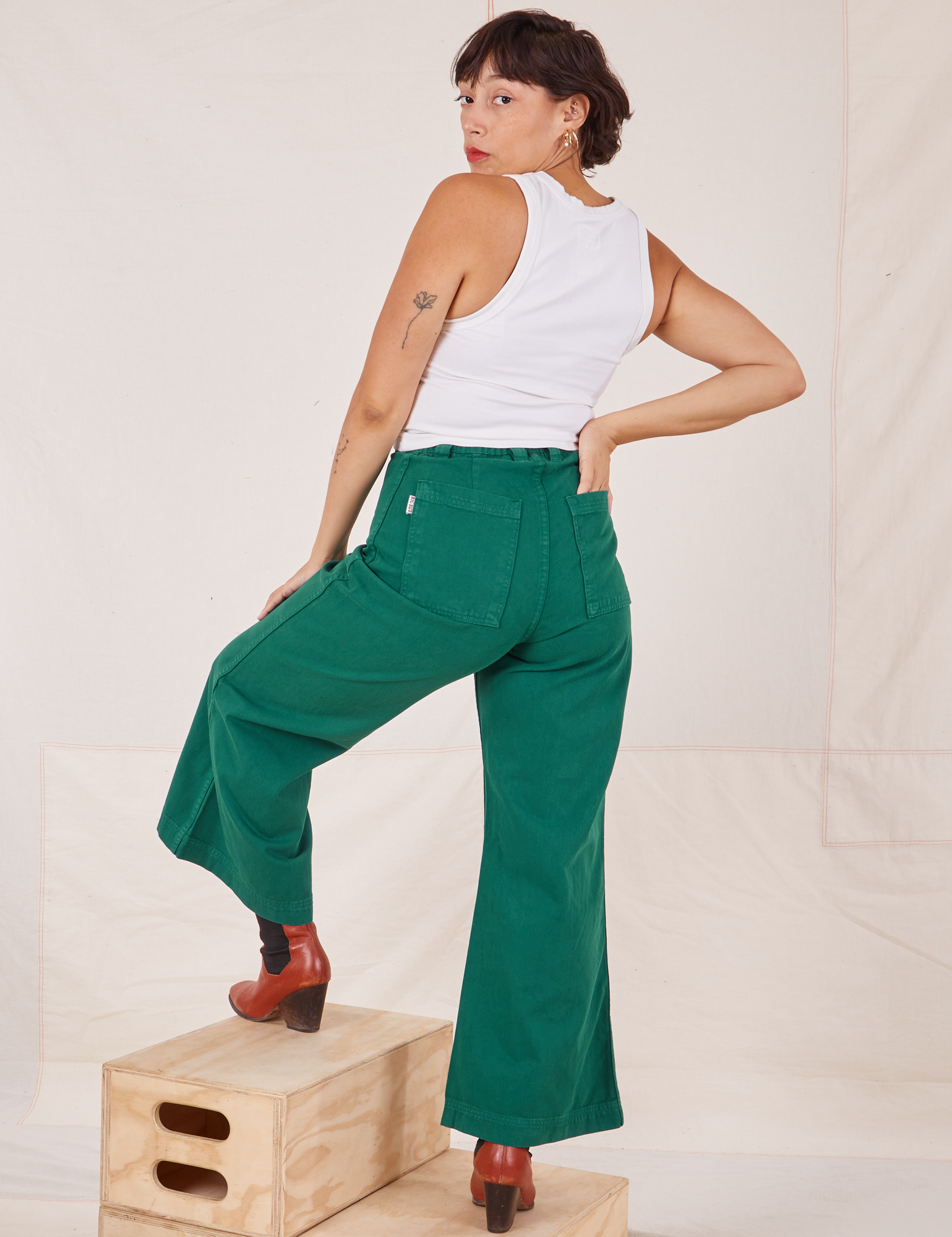 Back view of Bell Bottoms in Hunter Green worn by Tiara