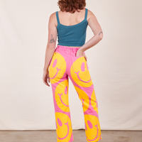 Back view of Icon Work Pants in Smilies and marine blue Cropped Cami worn by Alex