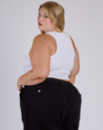 Angled view of Juliet in the Vintage Tee White Porthole Tank