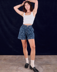 Alex is wearing Lazy Daisy Denim Shorts and Square Neck Tank in vintage tee off-white