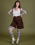 Sydney is 5’9” and wearing S Longline Work Shorts in Fudgesicle Brown paired with vintage tee white Cropped Tank